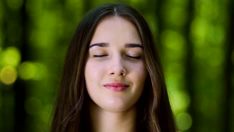 Zoom-in-meditating-woman-with-blessed-smile,-inner-temple-female-zen-outdoors