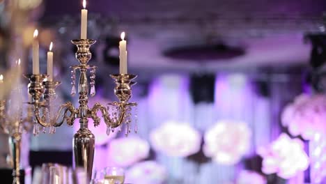 Decorative-candles-burning-on-a-banquet-table