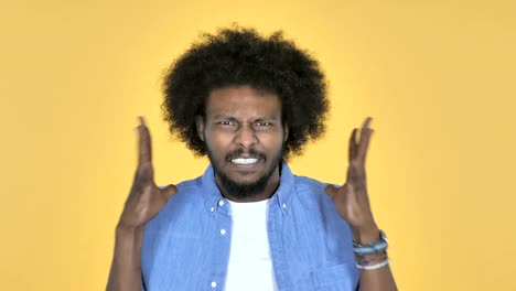 Screaming-Angry-Afro-American-Man-on-Yellow-Background