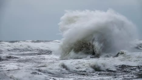 High-wave-breaking-on-the-rocks-of-the-coastline.-Extremely-Big-Wave-crushing-coast-,-Large-Ocean-Beautiful-Wave.-Super-Slow-Motion.