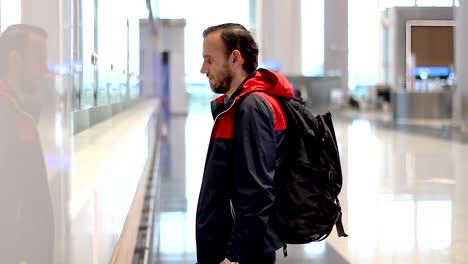 Passenger-Making-Check-In-At-The-Airport