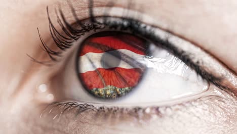 woman-green-eye-in-close-up-with-the-flag-of-Austria-in-iris-with-wind-motion.-video-concept