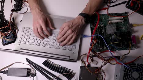 electronics-technician-working---testing-and-configuring-computer-hardware