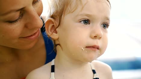 The-child-eats-cookies.-The-child-after-eating-in-the-pool-eats-cookies.