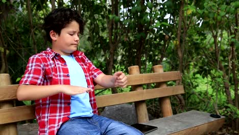 Child-scratching-his-self-at-park