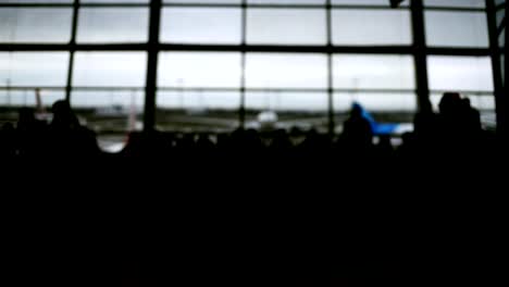 Defocused-airport-background,-Silhouette-People-walking-on-the-background.