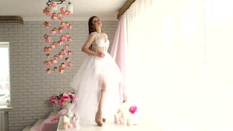 Girl-in-lingerie-and-sheer-fluffy-dress-in-Studio.