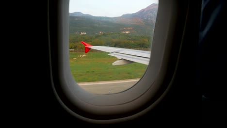 wing-of-the-aircraft-standing-on-the-ground-on-the-runway