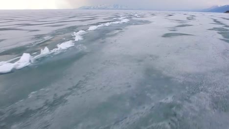 Flying-over-iced-sea-or-ocean-by-helicopter-.