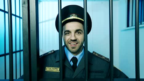 Portrait-of-a-policeman-in-a-prison-cell.