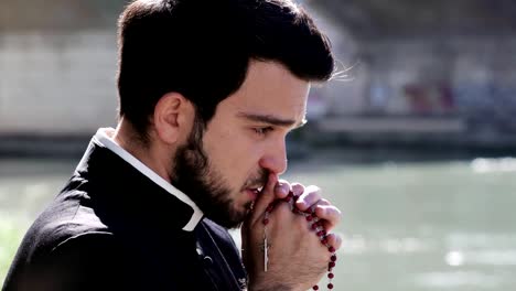 Sad-Young-Priest-Is-Praying:-Seeking-The-Aid-Of-God--outdoor