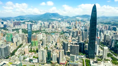 Aerial-hyper-lapse-of-Shenzhen-cityscape-under-cloudy-sky.