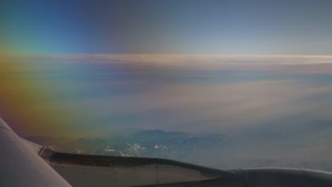 sun-light-airplane-engine-mountains-window-seat-view-4k-china