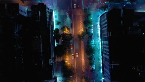 night-time-illumination-hainan-island-sanya-city-traffic-street-aerial-topdown-view-4k-china