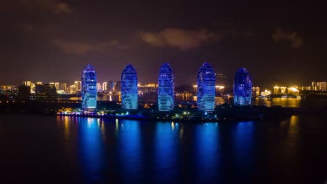 noche-iluminación-sanya-bay-isla-lujo-hotel-aéreo-timelapse-4k-en-china