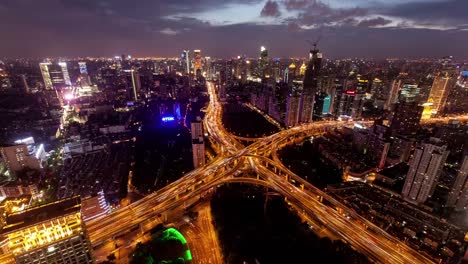 TL,-WS-Rush-hour-traffic-on-multiple-highways-and-flyovers-at-night-/-Shanghai,-China