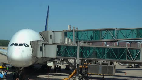 the-passengers-out-of-the-aircraft-through-a-glass-passage.