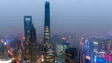 Time-lapse-of-Shanghai's-three-tallest-skyscrapers,-the-Shanghai-World-Financial-Center,-the-Jin-Mao-Tower,-and-the-Shanghai-Tower-at-sunset