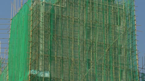 hong-kong-skyscraper-rooftop-construction-front-blue-sky-panorama-4k-china