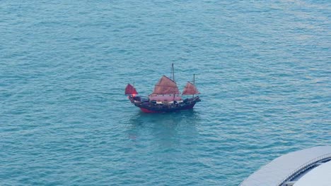 hong-kong-evening-time-famous-victoria-harbour-red-sailing-ship-panorama-4k-china