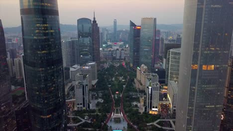 puesta-de-sol-tianhe-centro-polideportivo-estadio-guagzhou-ciudad-panorama-aéreo-4k-china