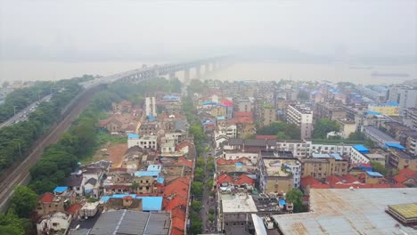 china-day-time-wuhan-city-traffic-changjiang-bridge-living-block-aerial-top-view-4k