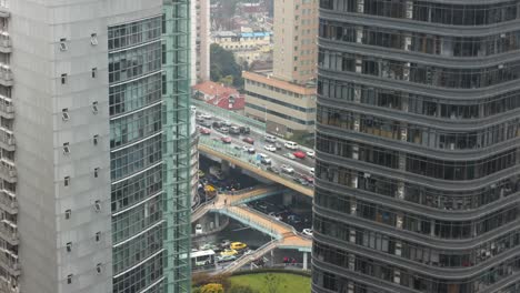 Traffic-junction-time-lapse-between-buildings-on-a-snowy-day