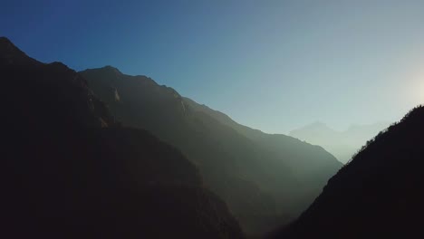 Sunrise-above-peak-in-the-Himalaya-range,-Nepal