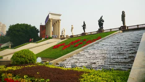 sunny-day-shenzhen-city-famous-park-entrance-flowers-slow-motion-panorama-4k-china