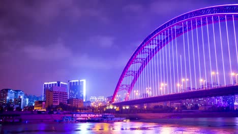 noche-iluminada-wuhan-ciudad-qingchuan-famoso-Puente-Río-Bahía-panorama-4k-china-de-lapso-de-tiempo