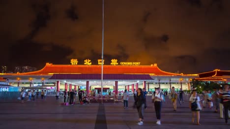 china-night-illuminated-zhuhai-city-gongbei-port-of-entry-entrance-square-panorama-4k-timelapse