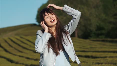 Excited-woman-is-shouting-and-touching-head-by-both-hands-standing-in-garden