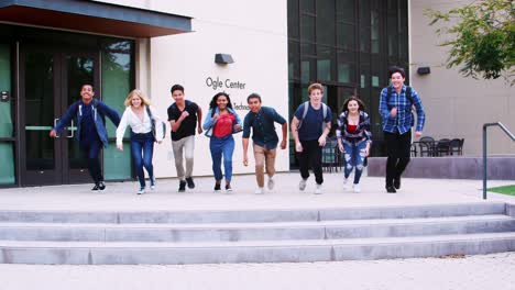 Group-Of-High-School-Students-Jumping-In-Air-Outside-College-Buildings