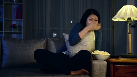 attractive-sweet-woman-sitting-on-comfortable-sofa