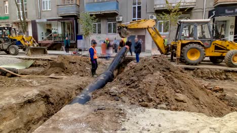 Excavator-at-working-on-pipeline-construction-site-of-replacing-water-supply-pipe-timelapse