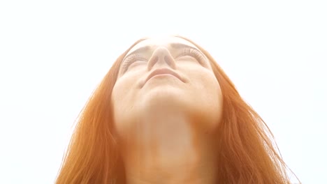 Blessed-woman-looks-up-to-sky,-God's-light-above-head,-female-with-holy-spirit