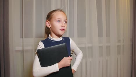 Angry-teenager-girl-playing-in-teacher-and-strictly-talking-with-someone