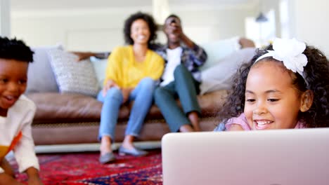 Front-view-of-cute-black-kids-having-fun-in-living-room-at-comfortable-home-4k