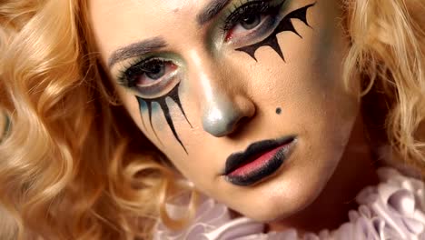 Portrait-of-young-beautiful-girl-with-make-up-skeleton-on-her-face.-Halloween.