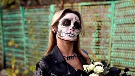 Close-up-portrait-of-a-gothic-girl-in-a-wedding-dress-and-a-creepy-make-up.