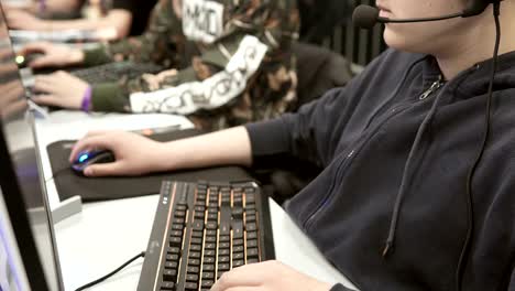 Team-of-professional-e-sportsmen-playing-competitive-video-games-at-the-cyber-games-tournament