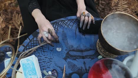 Halloween.-Young-Witch-Spells-At-The-Table.