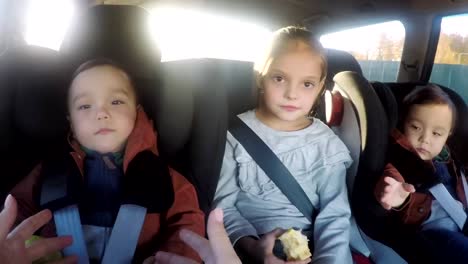 POV-of-Mother-Interacting-with-Children-Siting-in-Backseat-of-Car