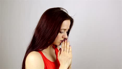 A-young-beautiful-woman-prays,-asking-God-for-help