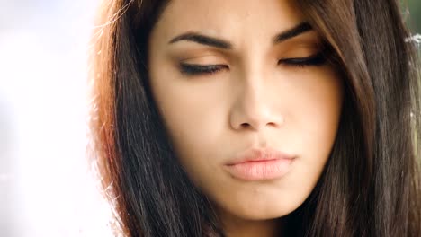 Portrait-Of-thoughtful-and-sad-pretty-Filipino-Woman-Outdoor