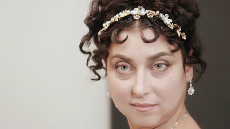 Close-up-historical-portrait-of-middle-aged-attractive-woman-in-18th-century-costume.-Look-of-Marie-Antoinette-or-bride-in-retro-style.-Slow-motion