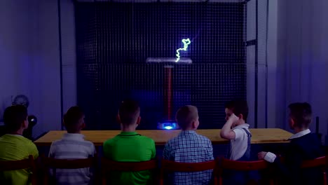 Group-of-children-watching-the-experiment-with-musical-tesla-coil