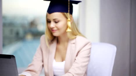 student-girl-in-bachelor-cap-showing-diploma