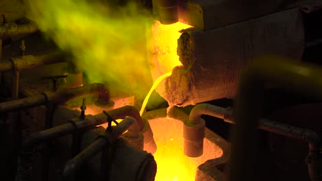 Metallurgical-production.-The-molten-metal-is-pouring-from-the-furnace,-the-hot-liquid-is-very-dangerous