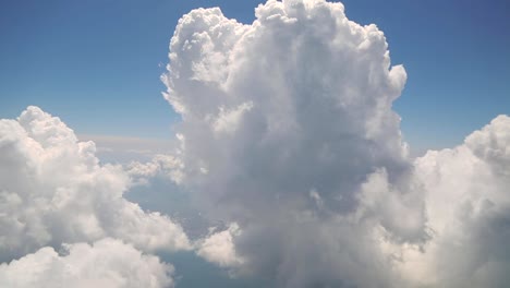 Flying-with-clouds,-watching-clouds-from-airplane-window